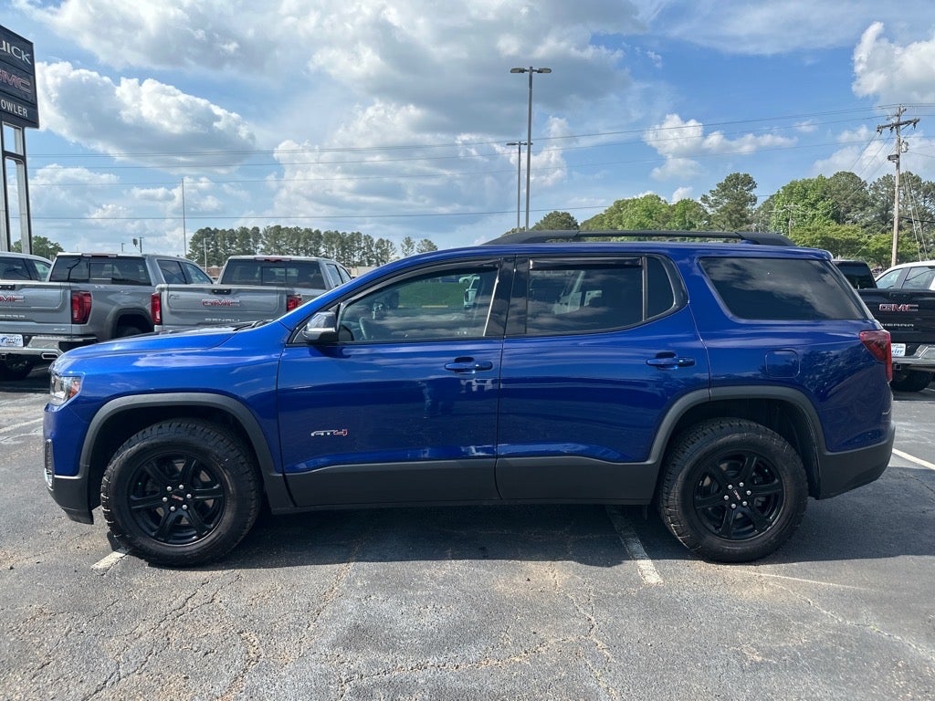 2023 GMC Acadia AT4 in Ultra Blue Metallic — front three-quarter view