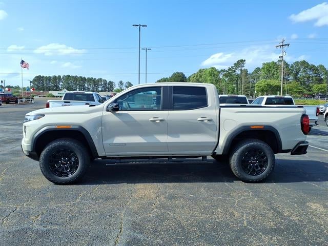 2026 GMC Canyon Elevation in Coastal Dune — front three-quarter view