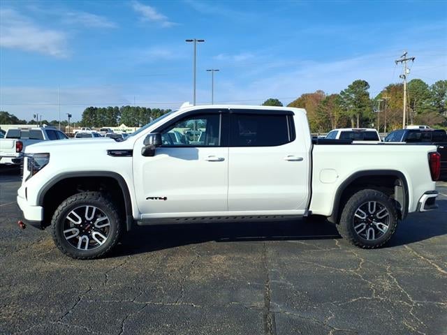 2024 GMC Sierra 1500 AT4 in Summit White — front three-quarter view