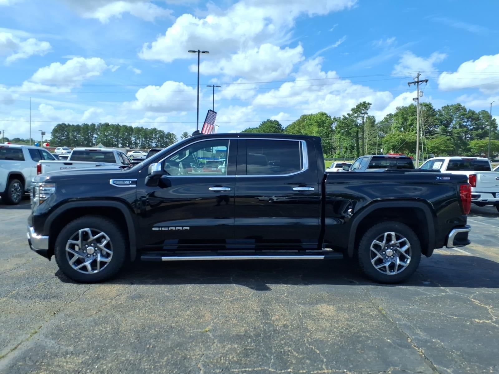 2026 GMC Sierra 1500 SLT in Onyx Black — front three-quarter view