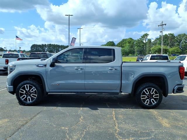2024 GMC Sierra 1500 AT4 in Thunderstorm Gray — front three-quarter view