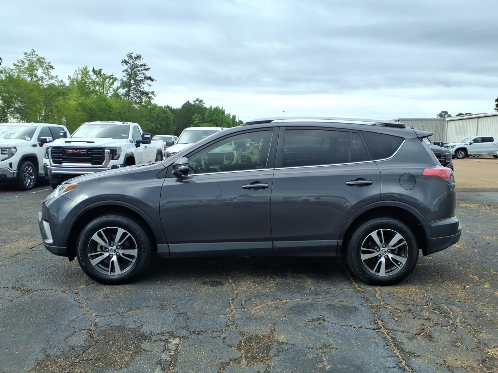 2018 Toyota RAV4 XLE in Magnetic Gray Met — front three-quarter view